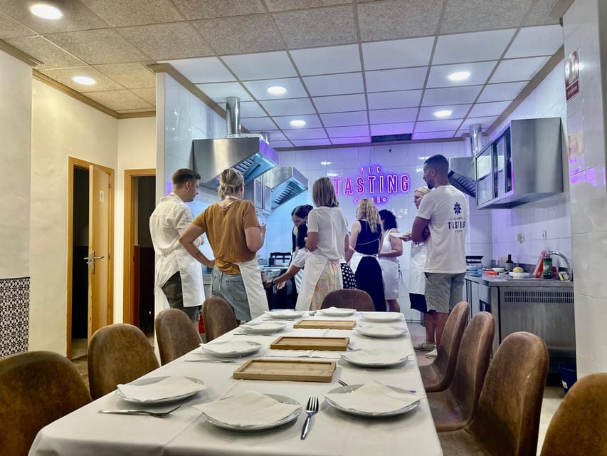 Alicante Paella Cooking Class, Tapas, Drinks and Market - Cooking Alicante rice in a purpose-built kitchen