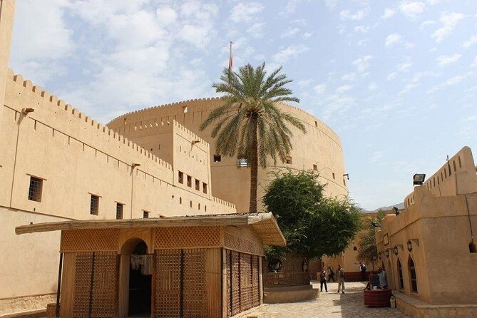 Amouage & Nizwa Full-Day Tour: Fort, Souq & Barakat Al Mouz - Falaj Al Khatmain explains how water reaches the fields