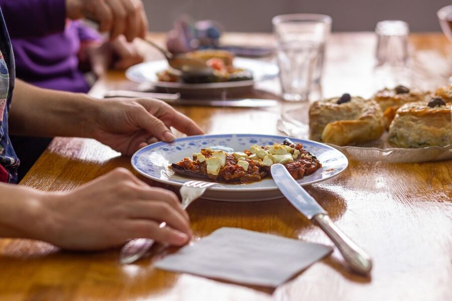 Athens: Food Market Visit and Cooking Class with Wine - Sitting down to eat what you made