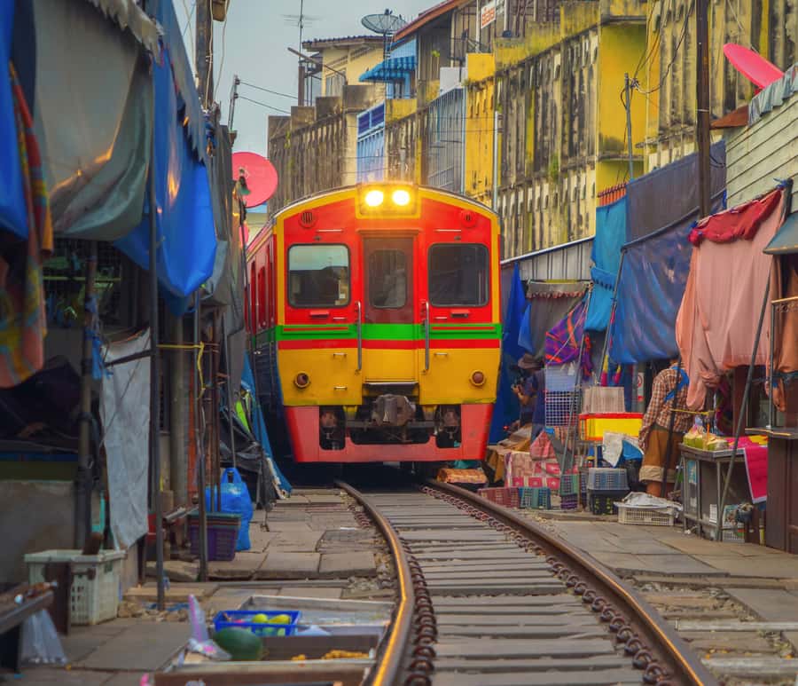 Bangkok: Amphawa Floating & Railway Markets Guided Day Tour - One hour on a traditional long-tail boat