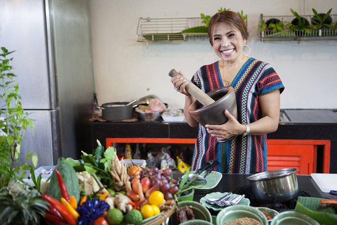 Bangkok Market Tour & Thai Cooking Class with Boat Ride with Aoy - Cooking Pad Thai, Tom Yum, and other Thai dishes