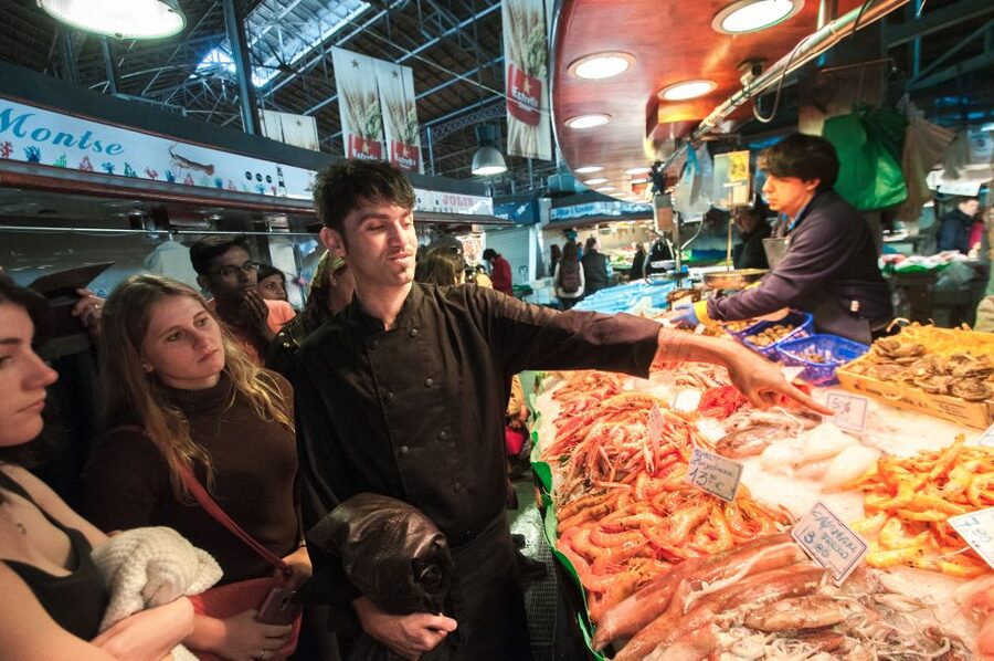 Barcelona: Paella Cooking Experience & Boqueria Market Tour - Building a seafood paella together