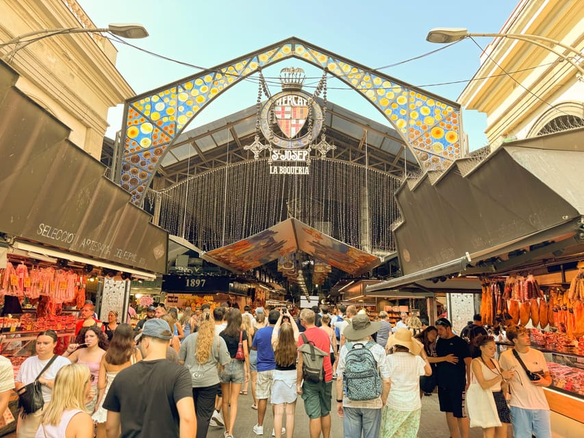 Barcelona: Seafood Paella Cooking Class & Boqueria market - Preparing pan con tomate, jamon, and Spanish drinks