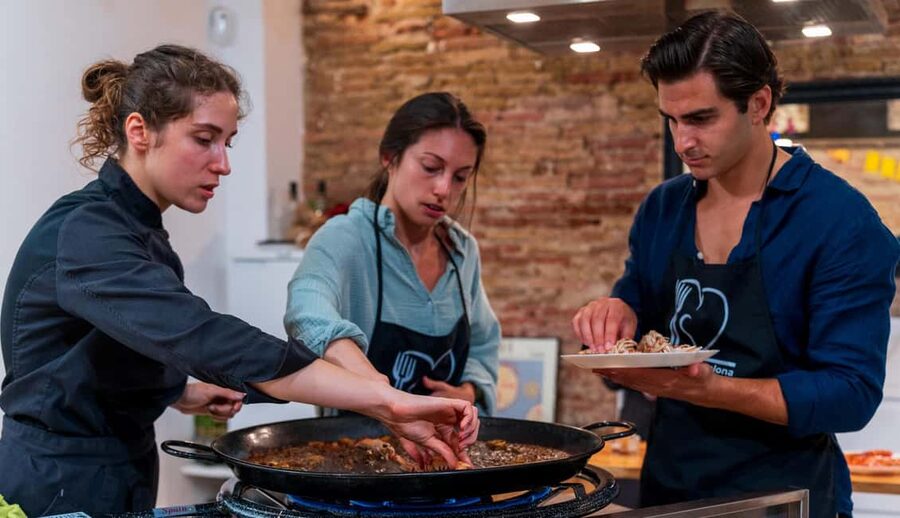 Barcelona: Seafood Paella Cooking Class & Boqueria market - Cooking with a professional chef in a group of 10