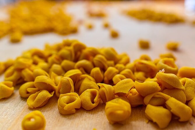 Bologna Food & Market Tour with 6 Tastings, Pasta, Wines & More - Comparing Parmigiano and Modena balsamic
