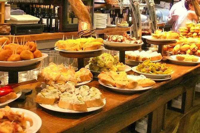 Boqueria & St Caterina Markets with Food & Tapas Small Group Tour - Old Town streets between the plates