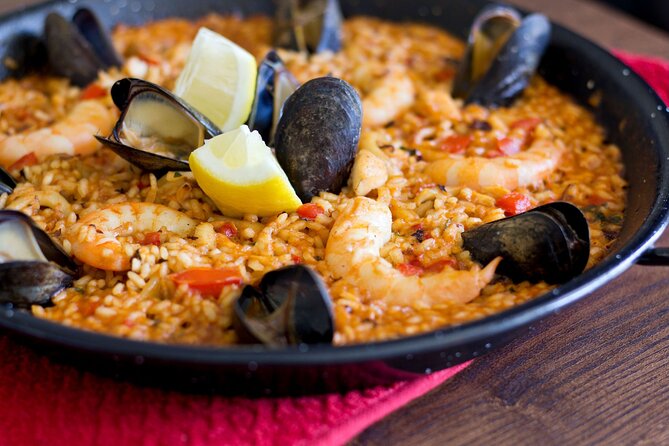 Cook Paella & Tapas + Market Tour in Barcelona (4-Course Meal) - Tapas and wine open the meal