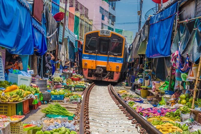 Damnoen Saduak Floating Market & Railway Market Tour from Bangkok - Maeklong Railway Market and the train through the stalls