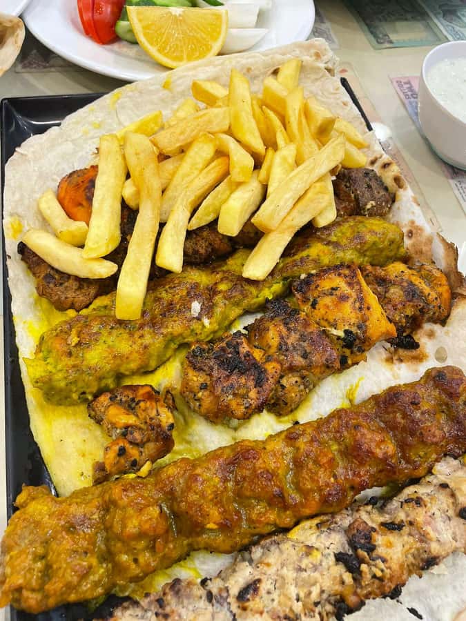 Dubai Food Tour: 4 Cuisines, Souks & Street Bites - Samosas, pani puri, pakora, and karak tea
