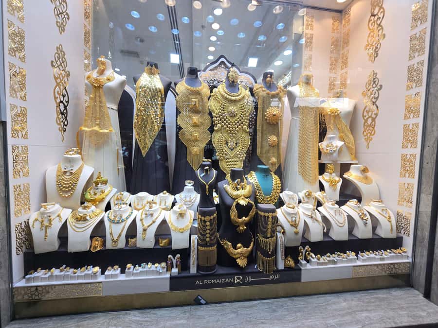 Dubai: Guided City Walking Tour to Spice and Gold Souk - Textile stalls and the old trading quarter