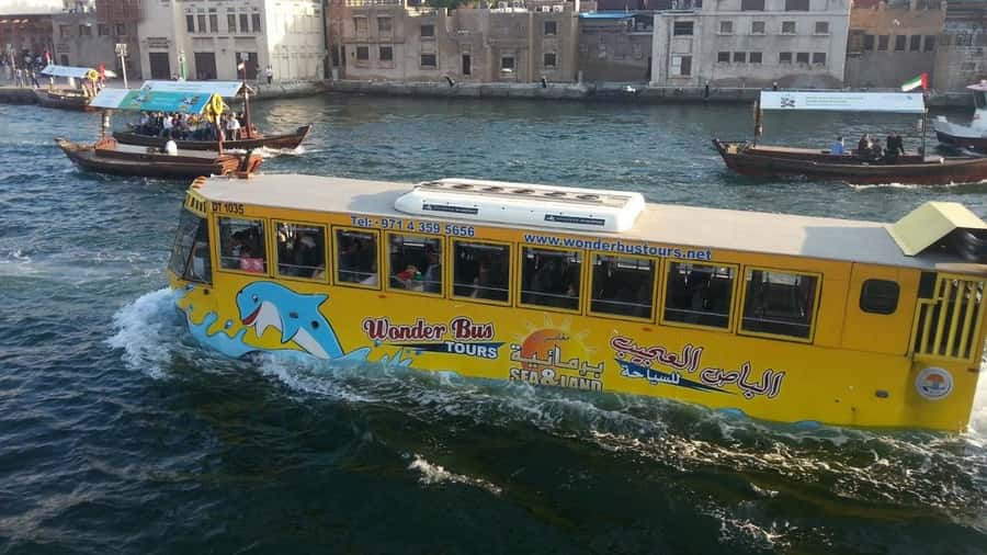 Dubai: Old town tour with Wonder Bus, souks, Creek and Guide - Textile Market, Heritage Village, and traditional Dubai