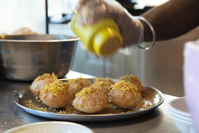Dubai Souks, Food & Culture Walking Tour - The SPINGO spice game and an Iranian cold treat