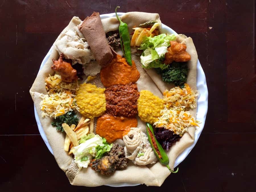 Ethiopian Culinary Tour - Market, Coffee Ceremony and More - Making injera from batter to plate