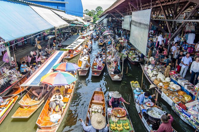 Famous Markets Tour: Maeklong Railway & Damnoen Saduak Floating - Maeklong Railway Market: where the tracks run through the stalls