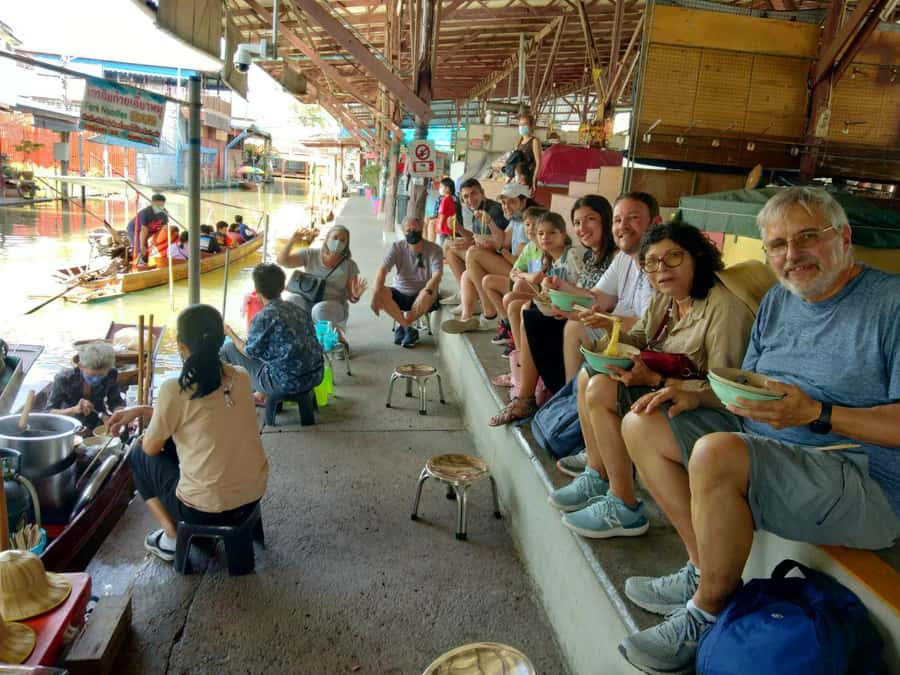 From Bangkok: Floating & Railway Markets Tour & Coconut Farm - Watching Mae Klong Railway Market close around the train