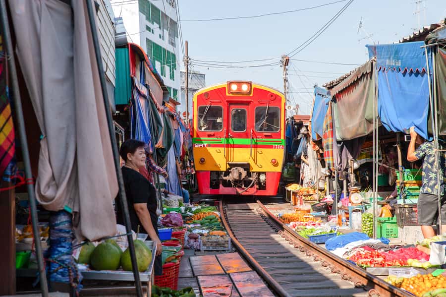 From Bangkok: Maeklong Railway and Floating Market Food Tour - Small groups, private tours, and the guide factor