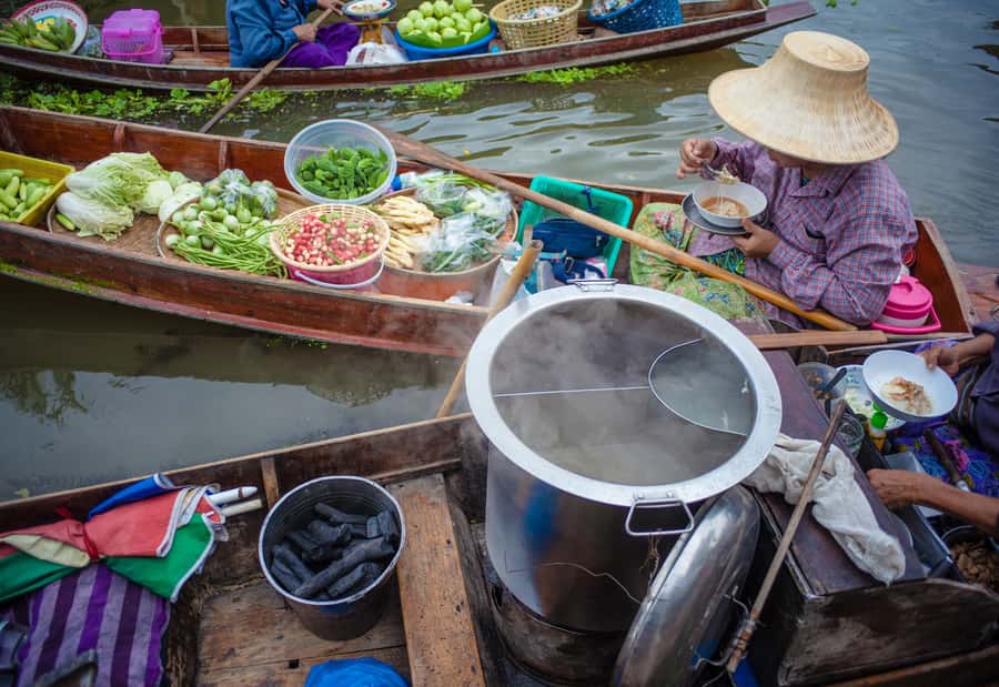 From Bangkok: Maeklong Railway and Floating Market Food Tour - Local snacks make the market visit more useful