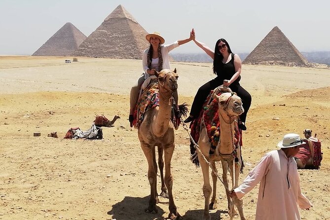 Giza Pyramids, Ride a Camel, Sphinx, Egyptian Museum& Bazaar, Lunch is included. - A 30-minute camel ride near the pyramids