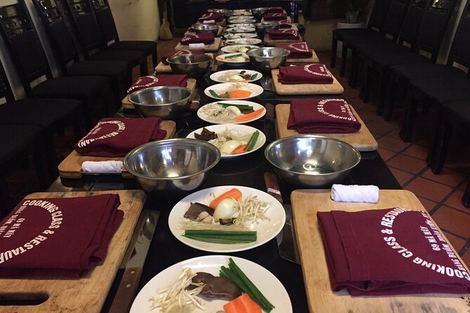 Hanoi Cooking Class and Market Tour in Ancient House - Sitting down to eat what you made