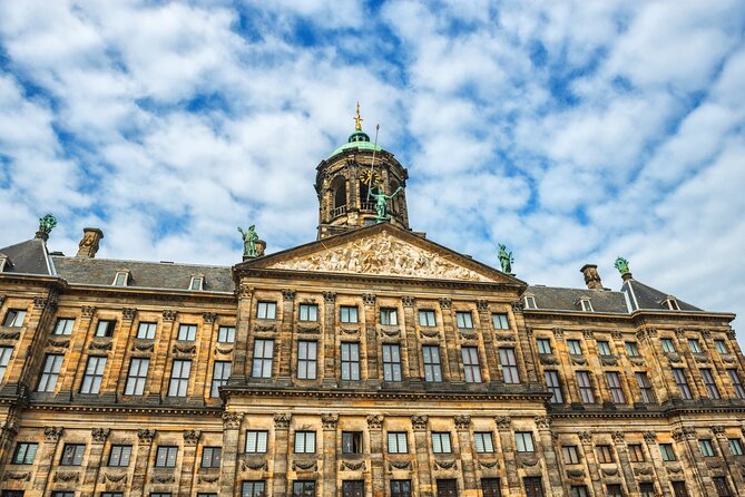 Historic Amsterdam Walking Tour: Royal Palace & Flea Markets - Along the Amstel River