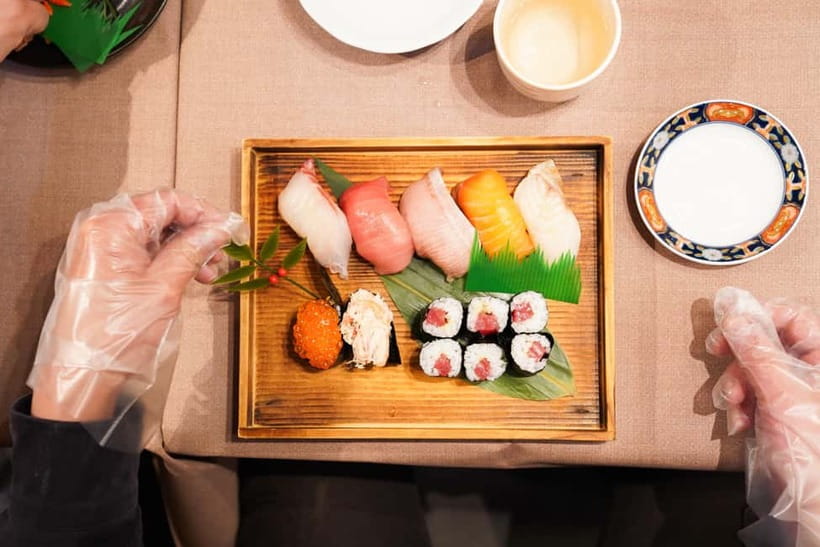Kanazawa: Sushi Making Experience at Oumicho Market - Wrapping two gunkan-maki pieces
