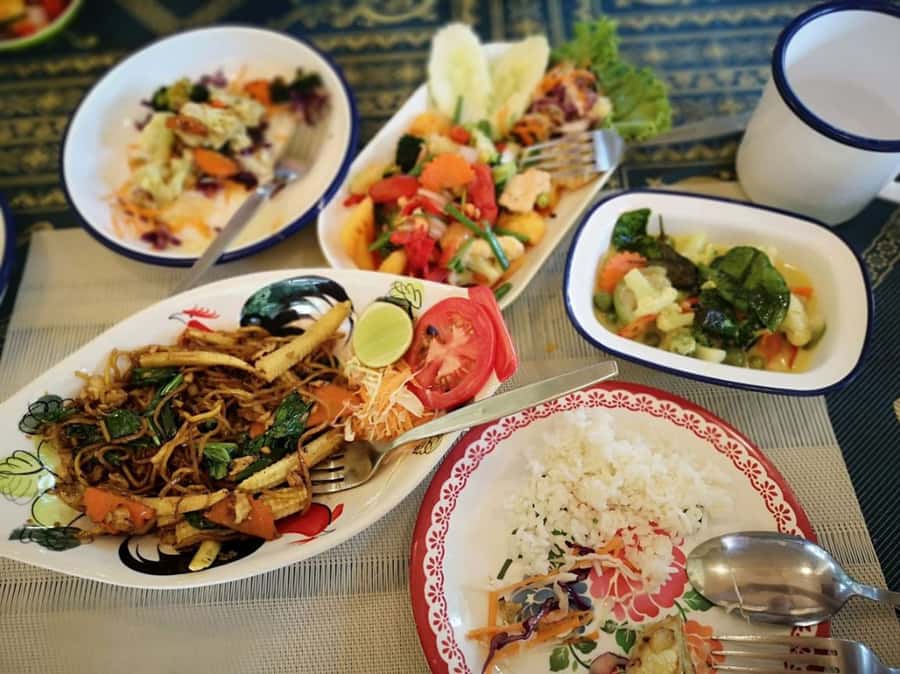 Koh Samui: Thai Cooking Class with Local Market Tour - Learning in a covered garden kitchen