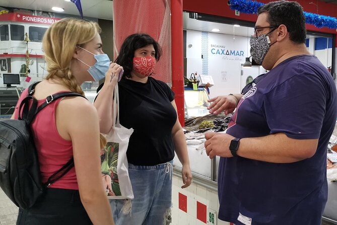 Lisbon Market and Food Tour with Cooking Class and Lunch - Choosing seafood for a Portuguese lunch
