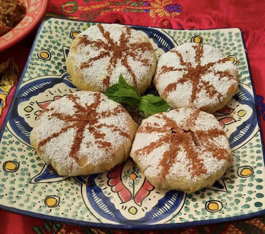 Marrakech: Traditional Moroccan Cooking Class & Market Visit - Sitting down to a very full meal
