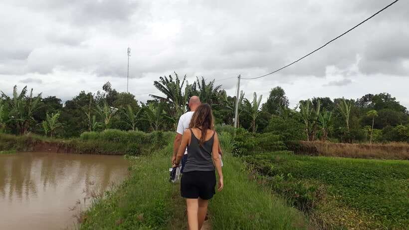 Mekong Day Tour by Car:Cai Be market, Local Island & Cycling - Fruit, music, and a local home