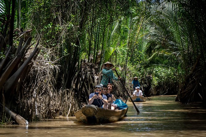 Mekong Delta 2-Day Tour: Floating Markets & Cultural Exploration - Coconut sweets, fruit, and the smaller canals of Tan Phong