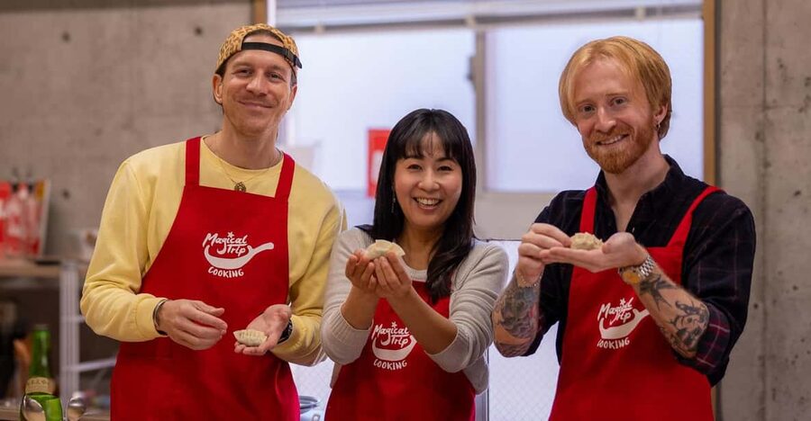 Osaka: Cooking Class & Sake Tasting with Local Market Visit - Folding gyoza turns lunch into a group activity