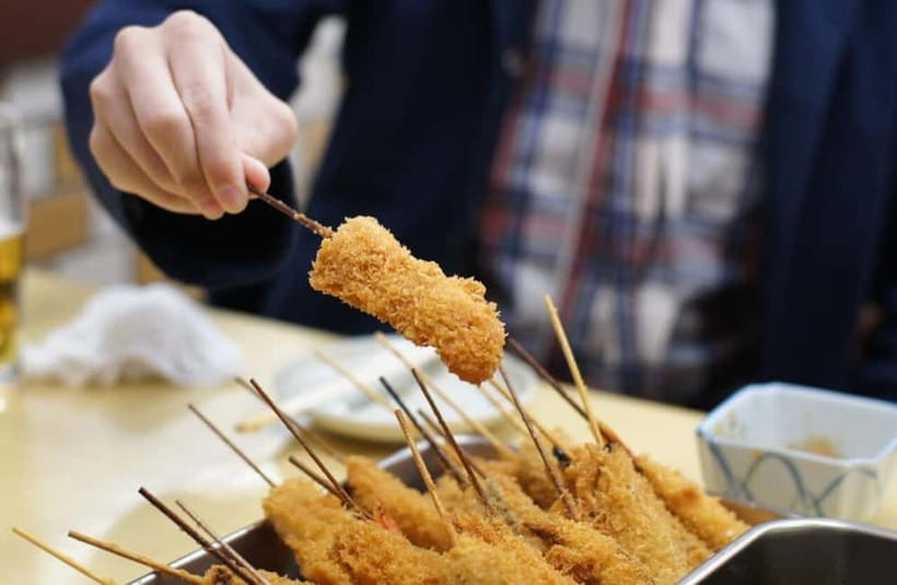 Osaka: Food Tour Kuromon Market & Dotonbori with Guide - Kuromon Market and the first taste of Osaka