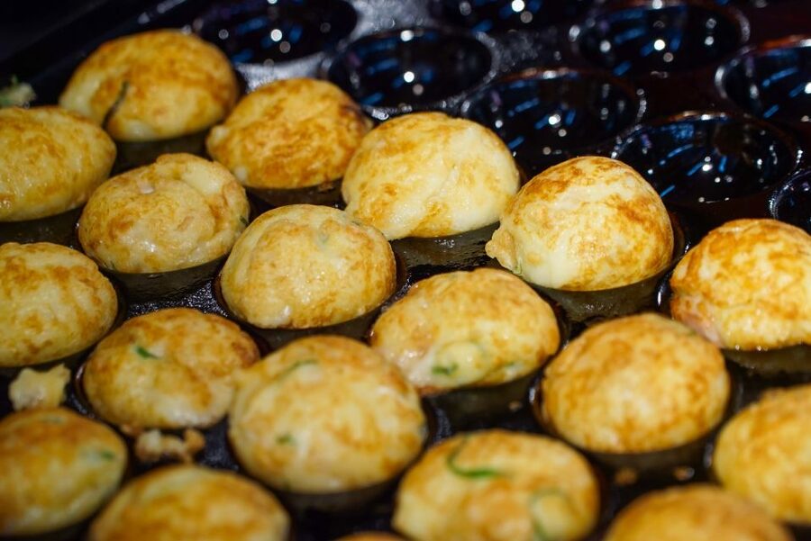 Osaka: Kuromon Market Food Walking Tour (6 stops, 6 tastes) - Stop four: a local restaurant and the walking story