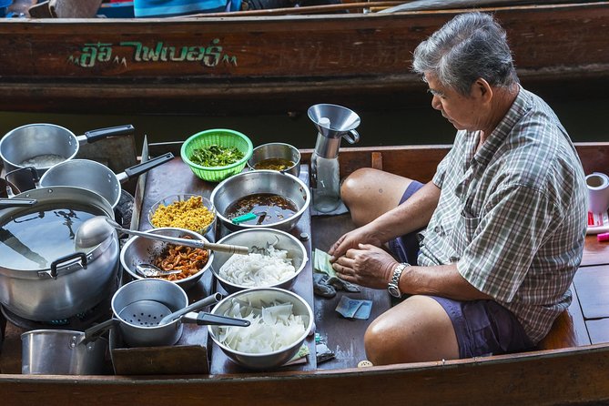 Private Guided Tour to Train Market and Damnoensaduak Floating Market - Booking, weather, and cancellation details
