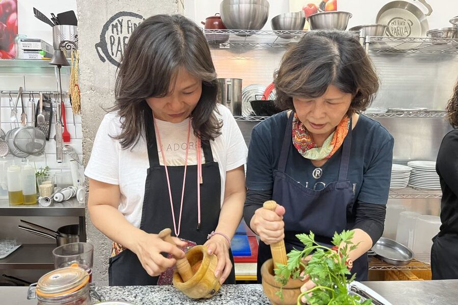 Real Paella Cooking Class – Market Visit & Sangría Workshop - Cooking paella with Anna, José, and the team