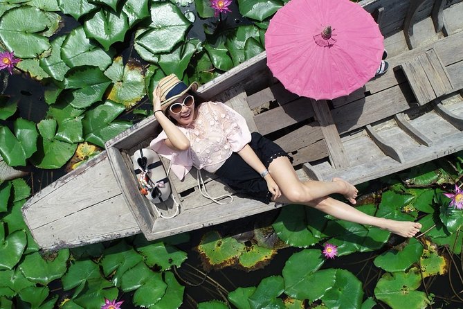Red Lotus garden market with Thai culture halfday tour - Pink lotuses from the deck of a long-tail boat