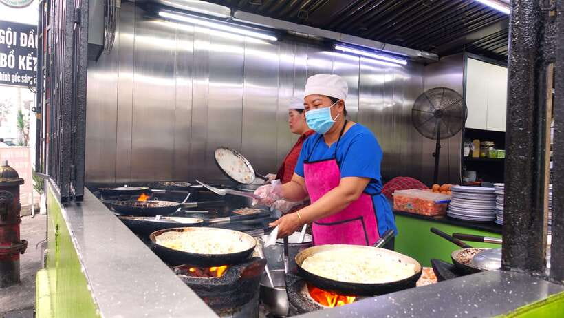 Saigon: Floating Market and Food Tasting Tour by Scooter - District 4 brings bánh mì and a local market stop