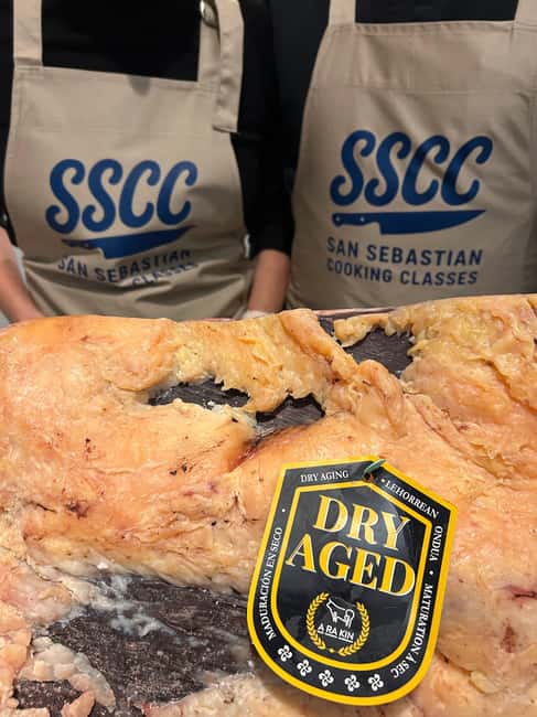 San Sebastián: Market Tour, Cooking Class, & Meal - Sitting down like a sidrería customer