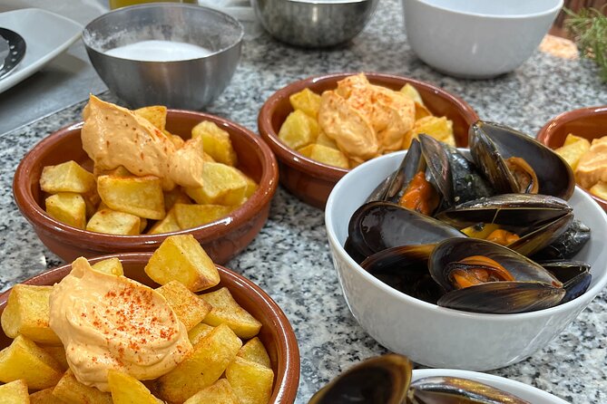 Seafood paella cooking class, tapas and visit to Ruzafa market. - Shopping for seafood at Ruzafa Market