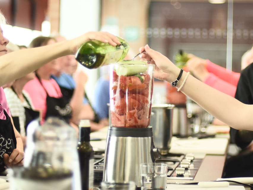 Seville: 3.5-Hour Spanish Cooking Class & Triana Market Tour - Inside the cooking school at stalls 75 to 77