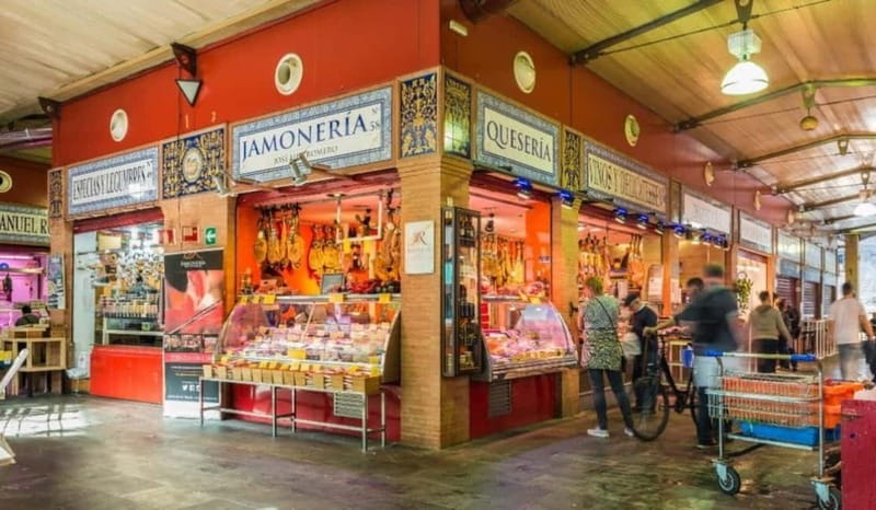 Seville: Tasting, History, Market visit and Tapas Tour - Across Triana Bridge to the market