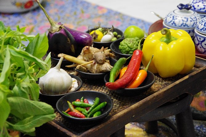 Silom Thai Cooking Experience with Market Visit - Preparing classic Thai dishes from scratch