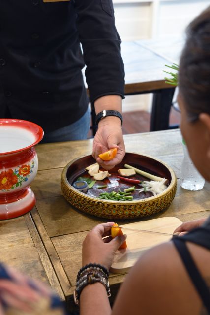 Sukhumvit: Hands-on Thai Cooking Class & Market Tour in BKK - Afternoon and evening classes trade the market for mango carving