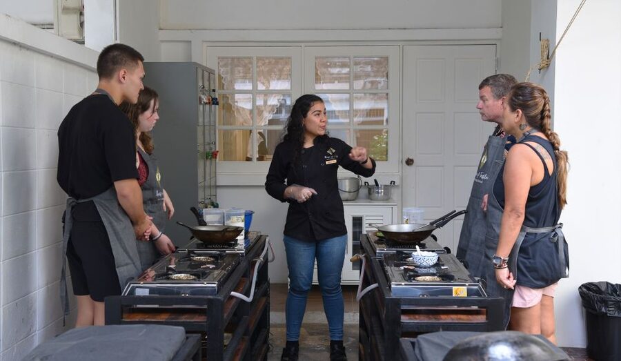 Sukhumvit: Hands-on Thai Cooking Class & Market Tour in BKK - The instructors keep beginners moving