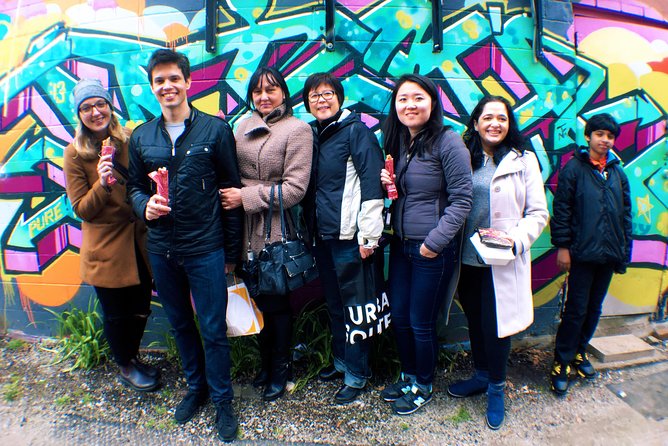 Toronto's First Food Tour: Taste the World in Kensington Market - Walking through independent shops and food counters