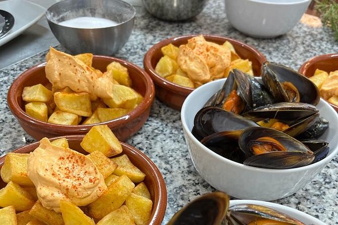 Valencian paella cooking class, tapas and visit to Ruzafa market. - Making sangria before the paella